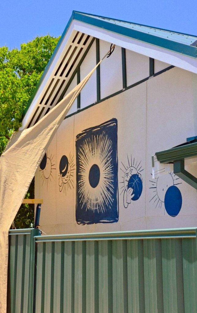 A comic like mural depicting an eclipse - by illustrator Vilde Espenes