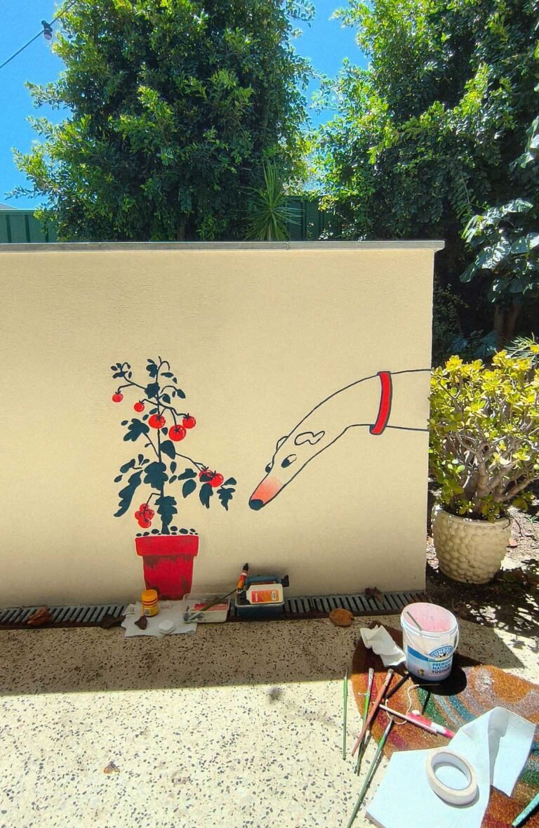 Two colour mural depiction a greyhound leaning towards a tomato plant growing out of a terracotta pot - by illustrator Vilde Espenes